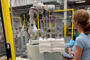 FILE PHOTO: A researcher works on a new robot for handling sheets in Cincinnati