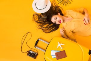 flat-lay-woman-with-travel-essentials-1783924675-821x550
