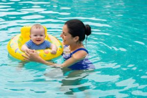 mother-and-baby-enjoying-a-swim-in-the-pool-together-photo-1784716718-821x550